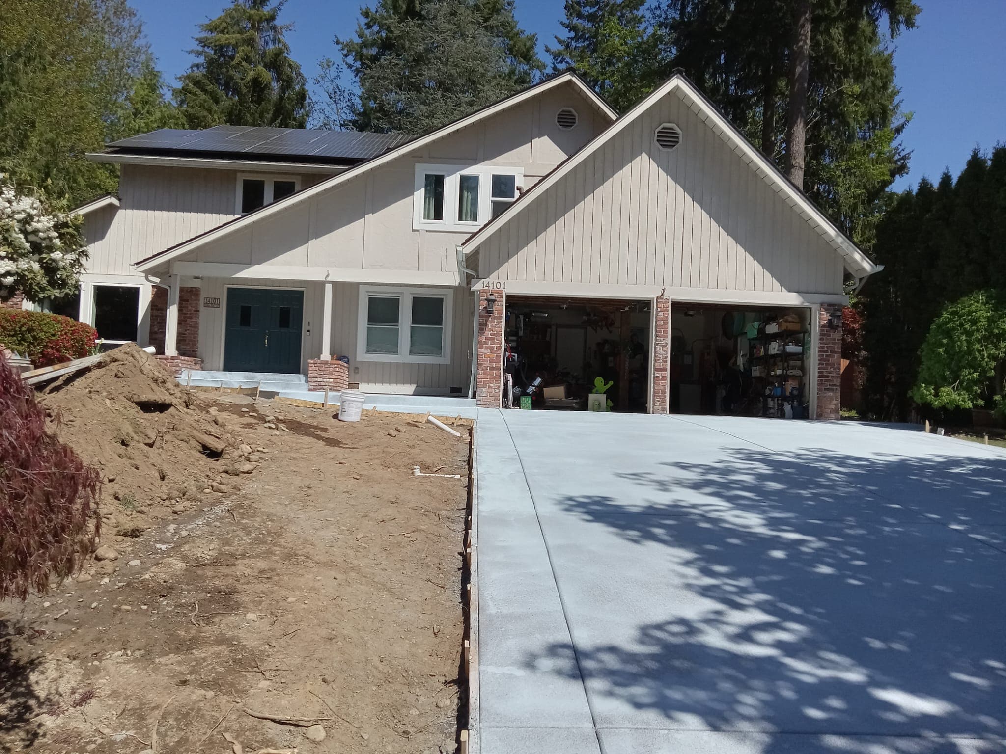 Freshly finished concrete driveway at newly built Pacific Northwest home