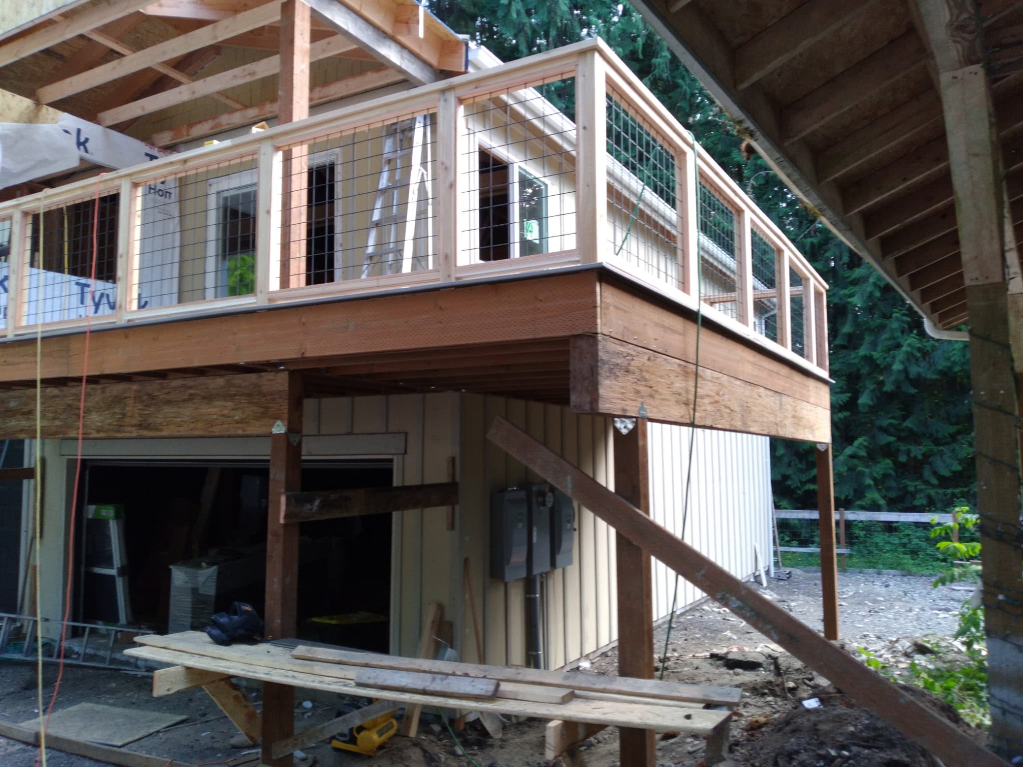 Second-story deck framing and structure under construction on residential home
